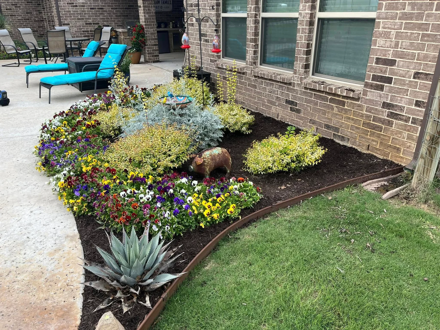 Colorful established garden after Braziel refreshed the mulch