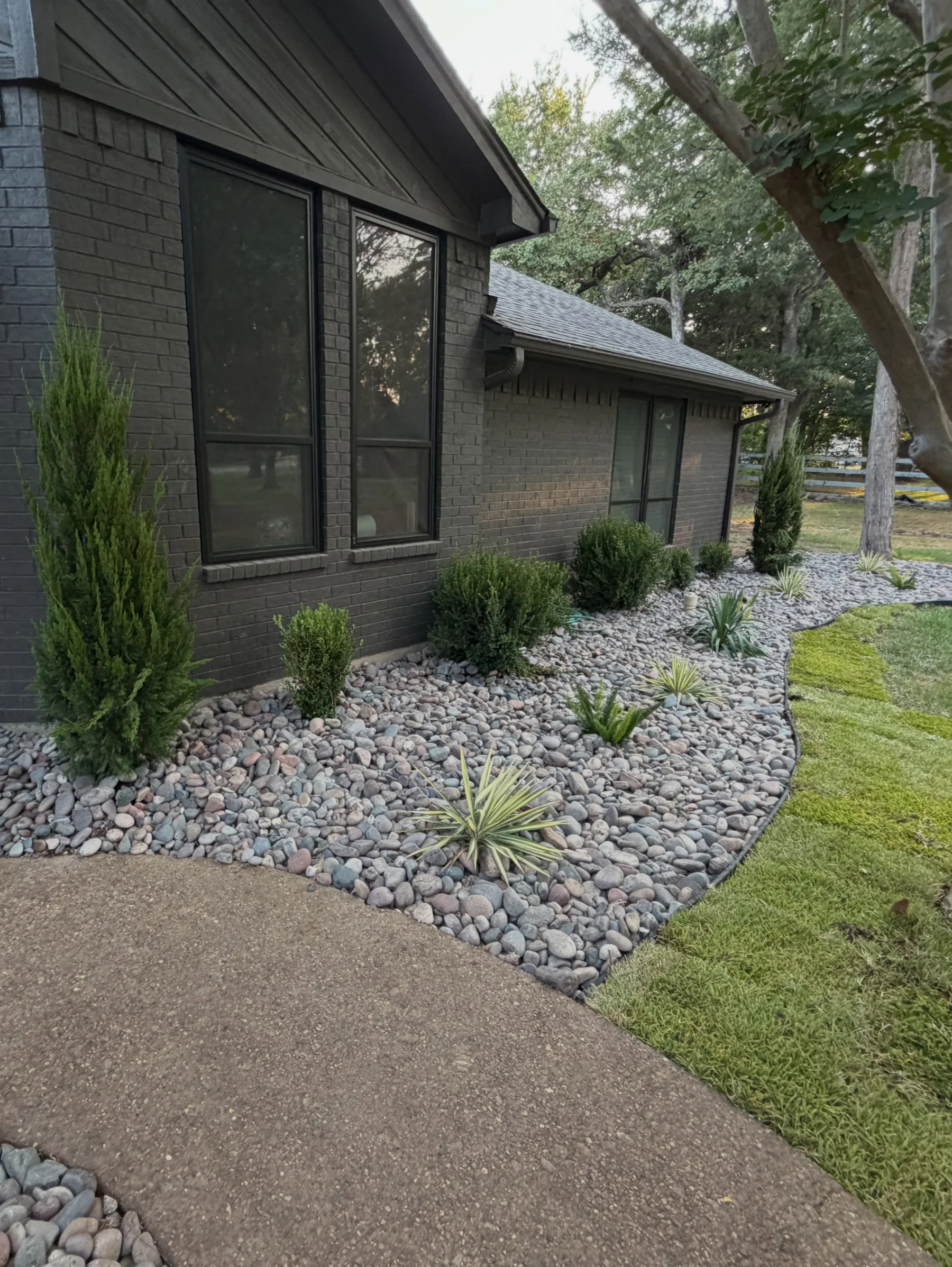 River rock, ornamental planting and the path through the Southlake landscape